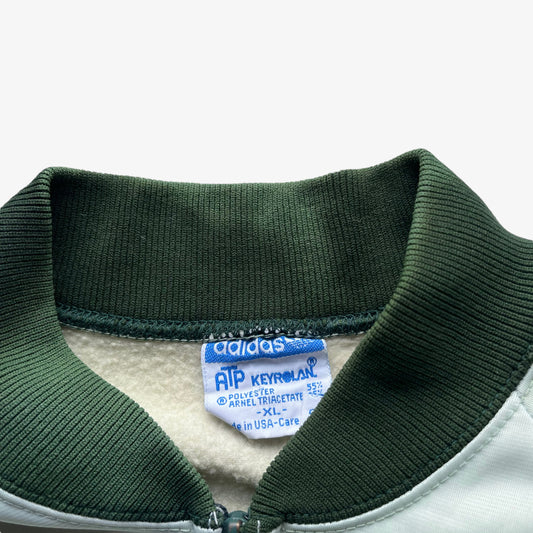 Adidas ATP Keyrolan label stitched inside of men's vintage 70s green track jacket.