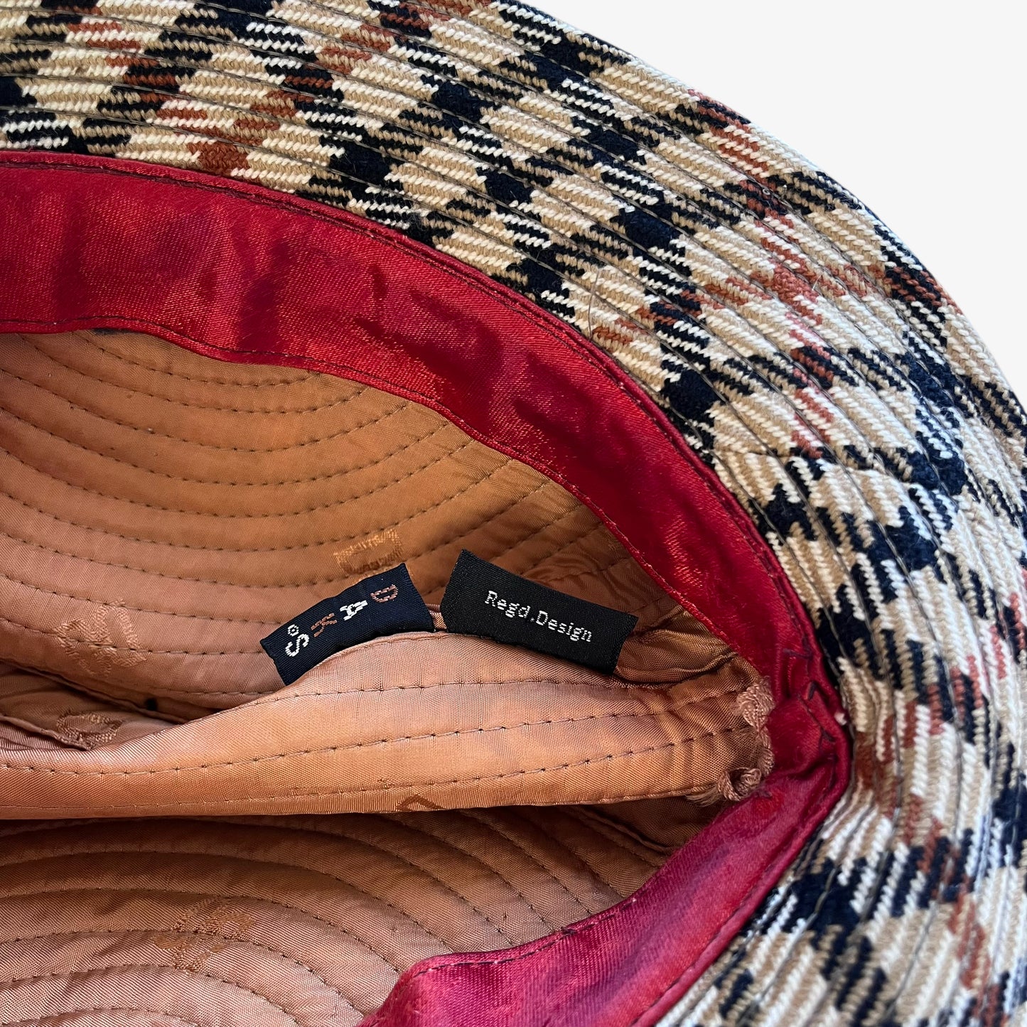 Daks label stitched inside of vintage 70s women's house check print wool trilby hat.