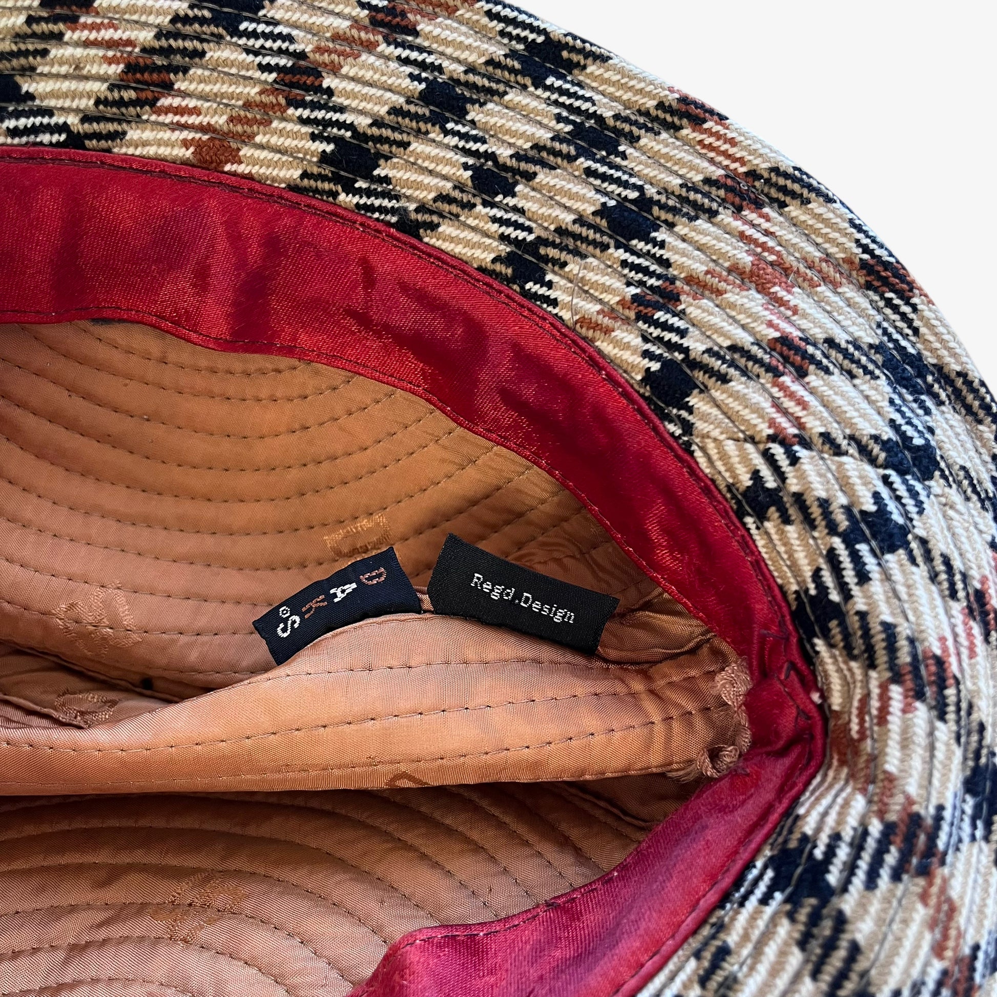 Daks label stitched inside of vintage 70s women's house check print wool trilby hat.