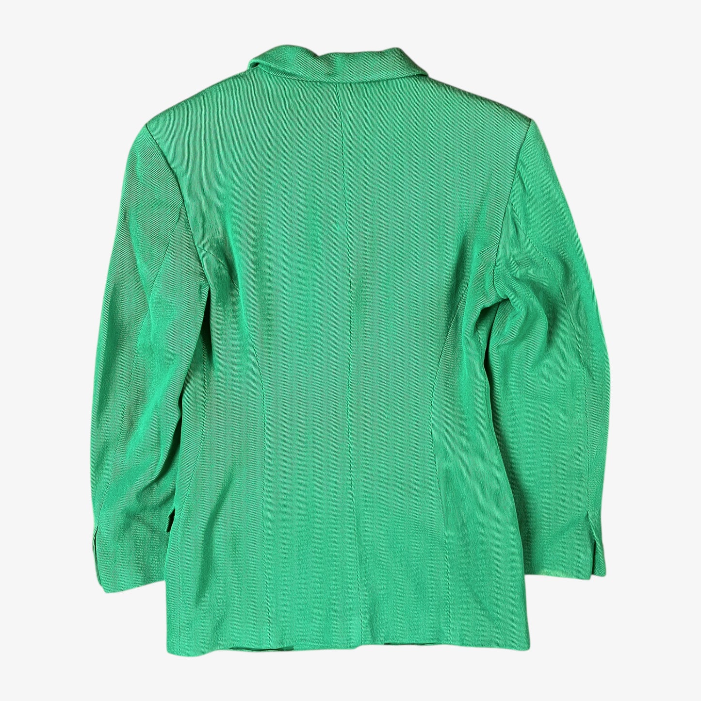 Back of vintage 70s Versace Sport women’s green wool blazer with sun-engraved gold buttons.