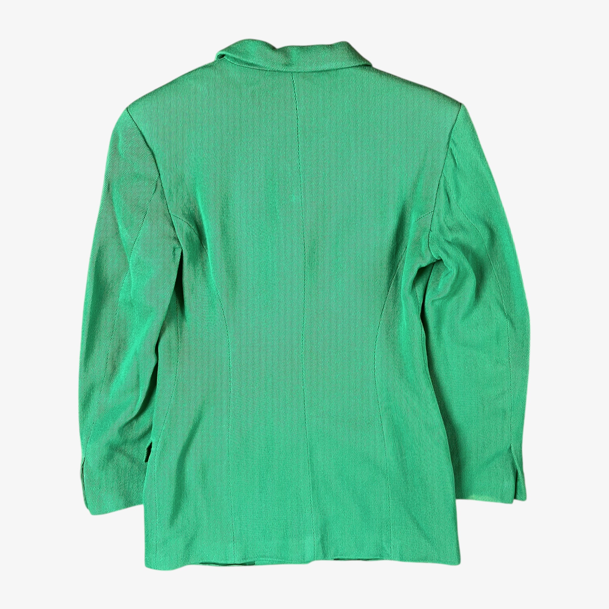 Back of vintage 70s Versace Sport women’s green wool blazer with sun-engraved gold buttons.