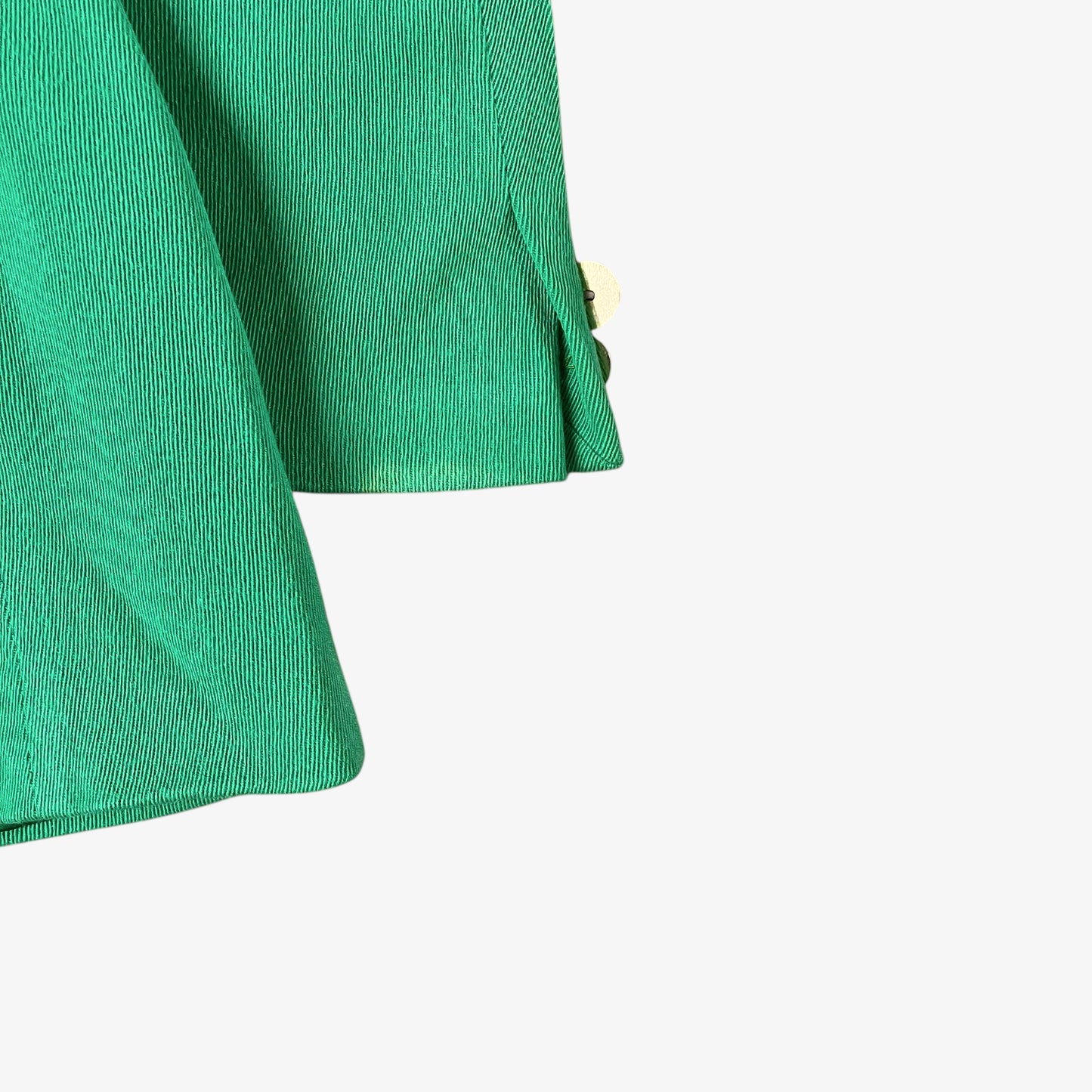 Sleeve cuff of vintage 70s Versace Sport women’s green wool blazer.