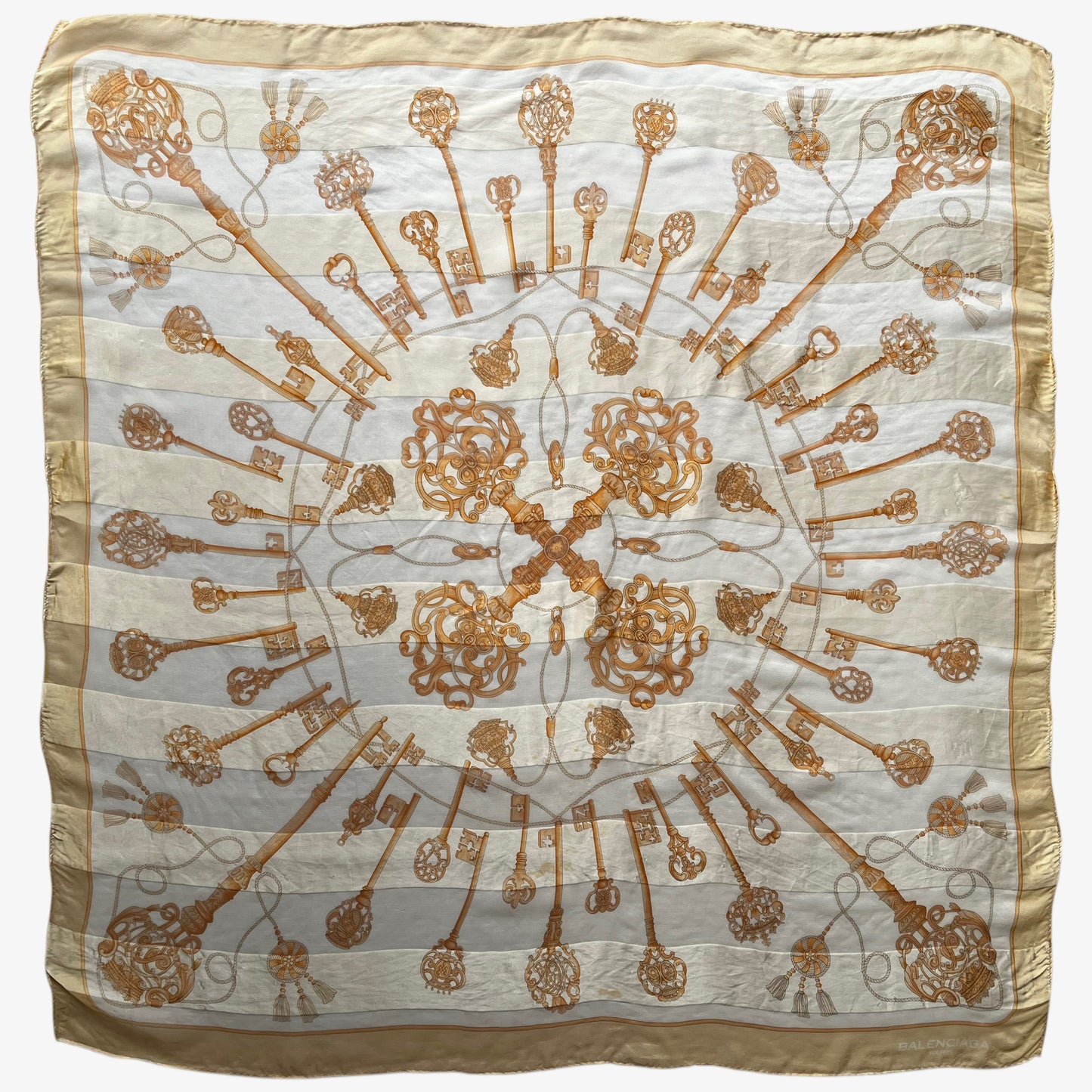 Women's vintage 80s Balenciaga Paris yellow silk scarf with a gold baroque style key print.