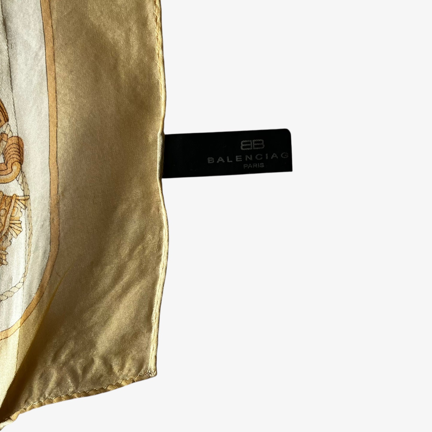 Balenciaga Paris label on a women's vintage 80s designer yellow silk scarf with a gold baroque style key print.