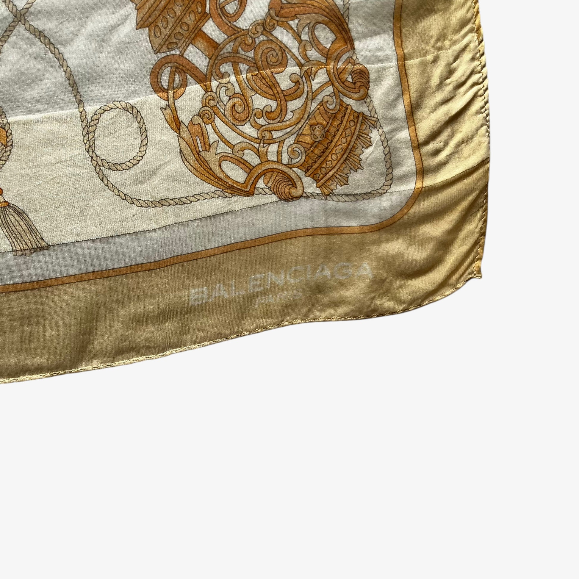 Balenciaga Paris spell out logo on a women's vintage 80s designer yellow silk scarf with a gold baroque style key print.