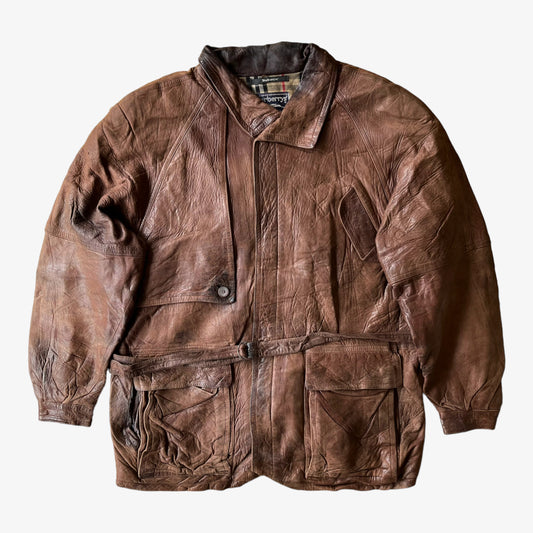 Vintage 80s Men's Burberry brown leather utility jacket with nova check wool blend lining, displayed on a white background.