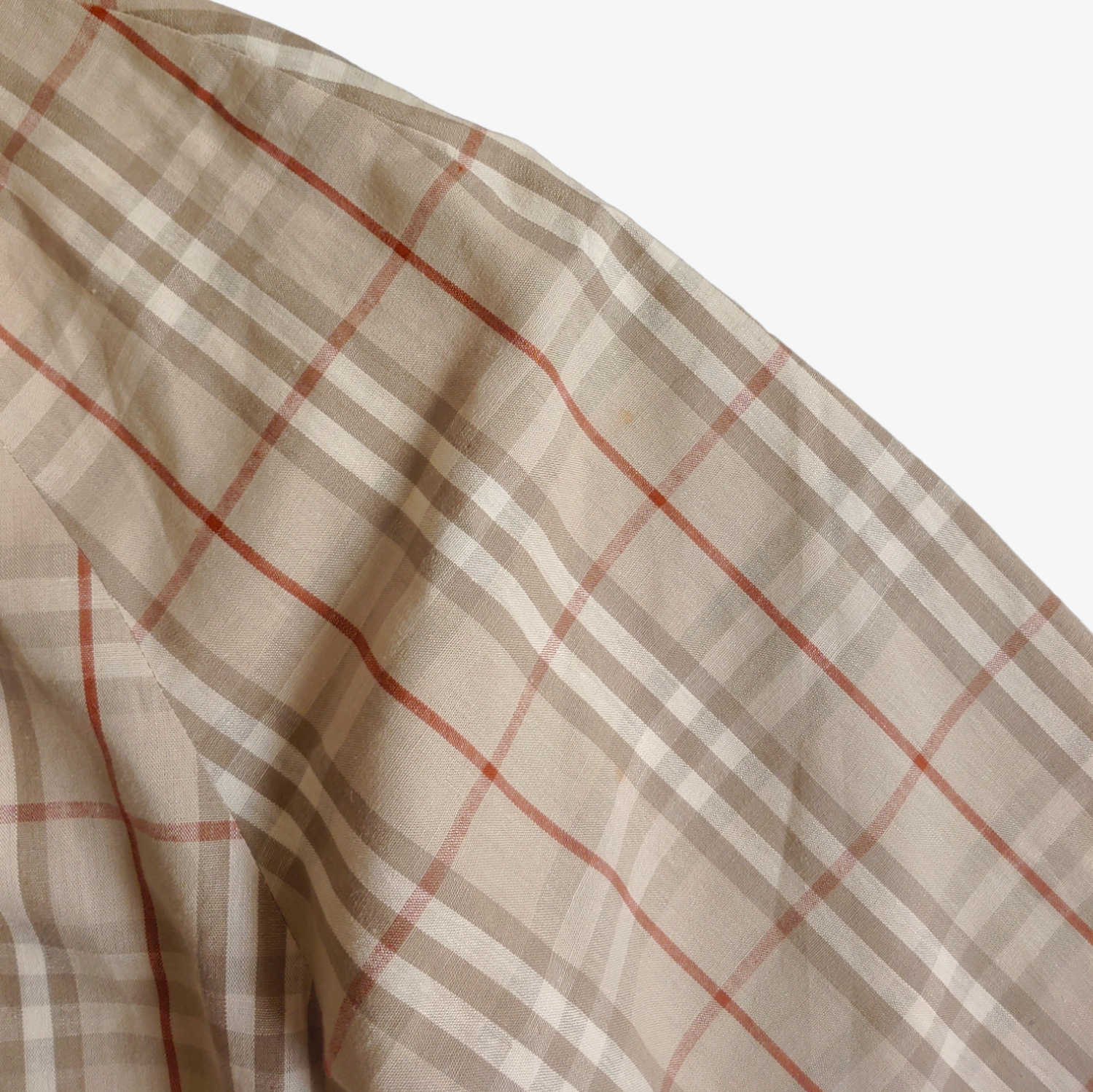 Wear on vintage 1980s men's Burberry nova check robe in beige, brown, and grey checkered pattern.