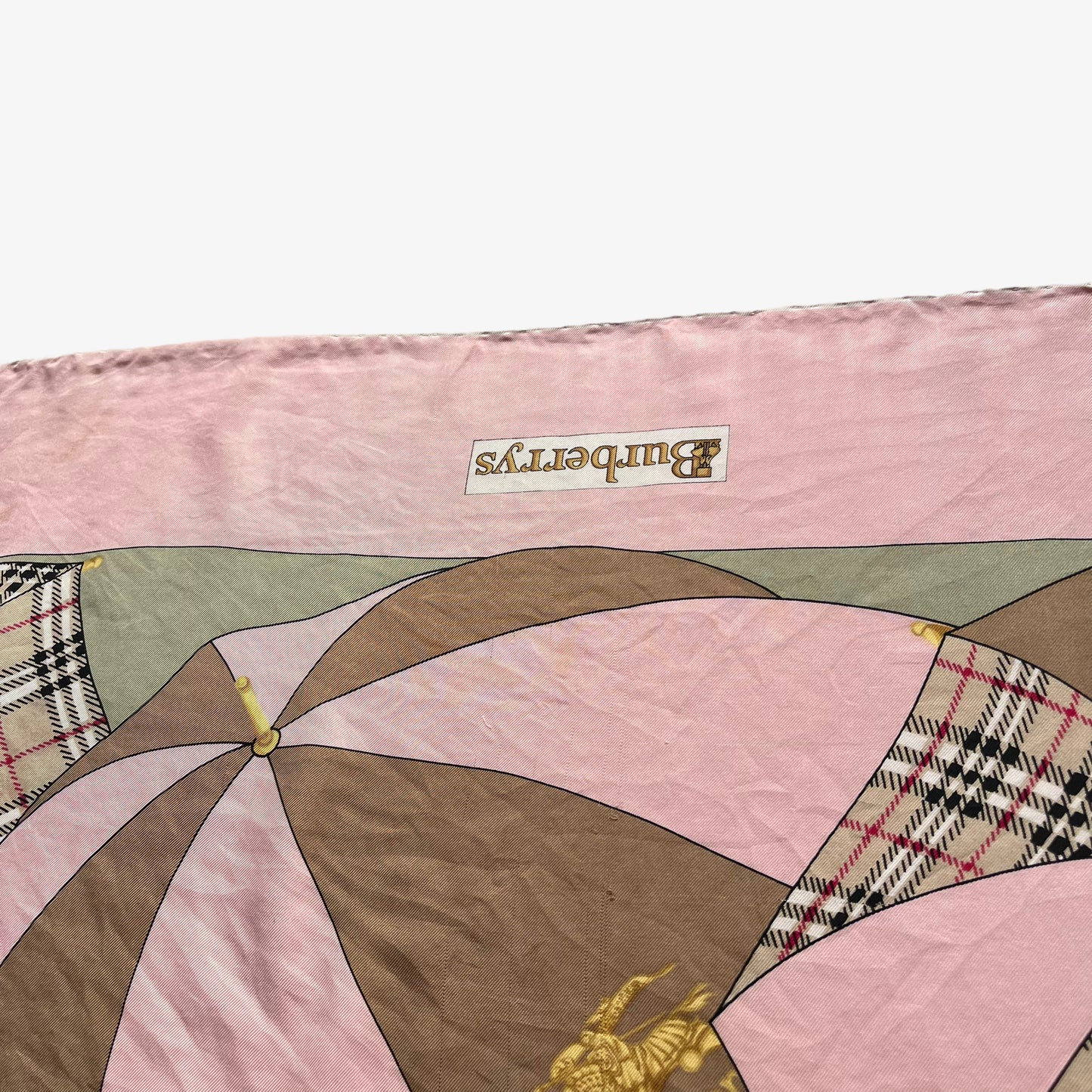 Patina on women's vintage 80s Burberry nova check umbrella print pink silk scarf.