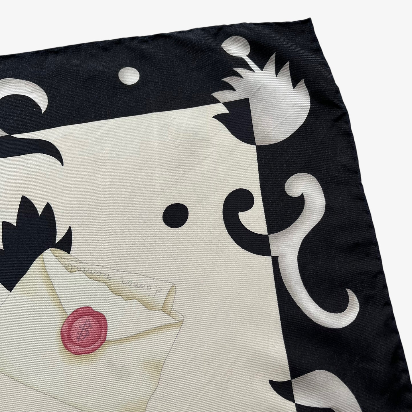 Signature on women's vintage 80s Bvlgari abstract geometric accessories print black silk scarf.