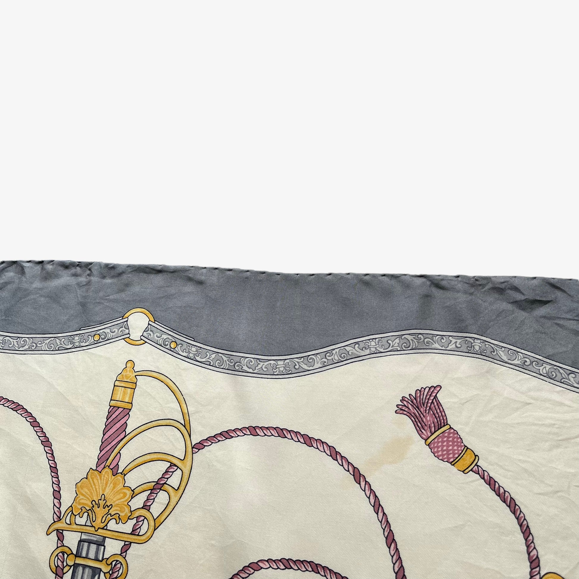 Patina on women's vintage 80s Celine Paris grey silk scarf features a royal emblem and baroque sword print.