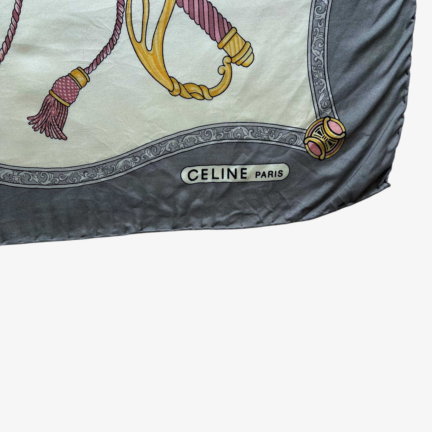 Celine Paris spell out logo of women's vintage 80s grey silk scarf features a royal emblem and baroque sword print.