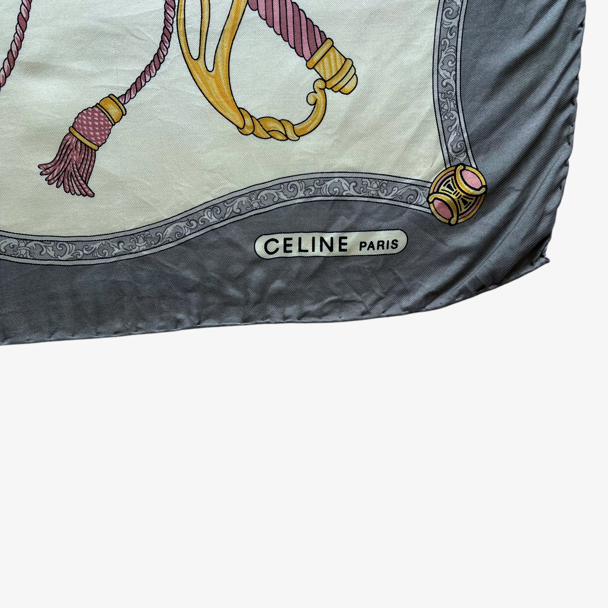 Celine Paris spell out logo of women's vintage 80s grey silk scarf features a royal emblem and baroque sword print.