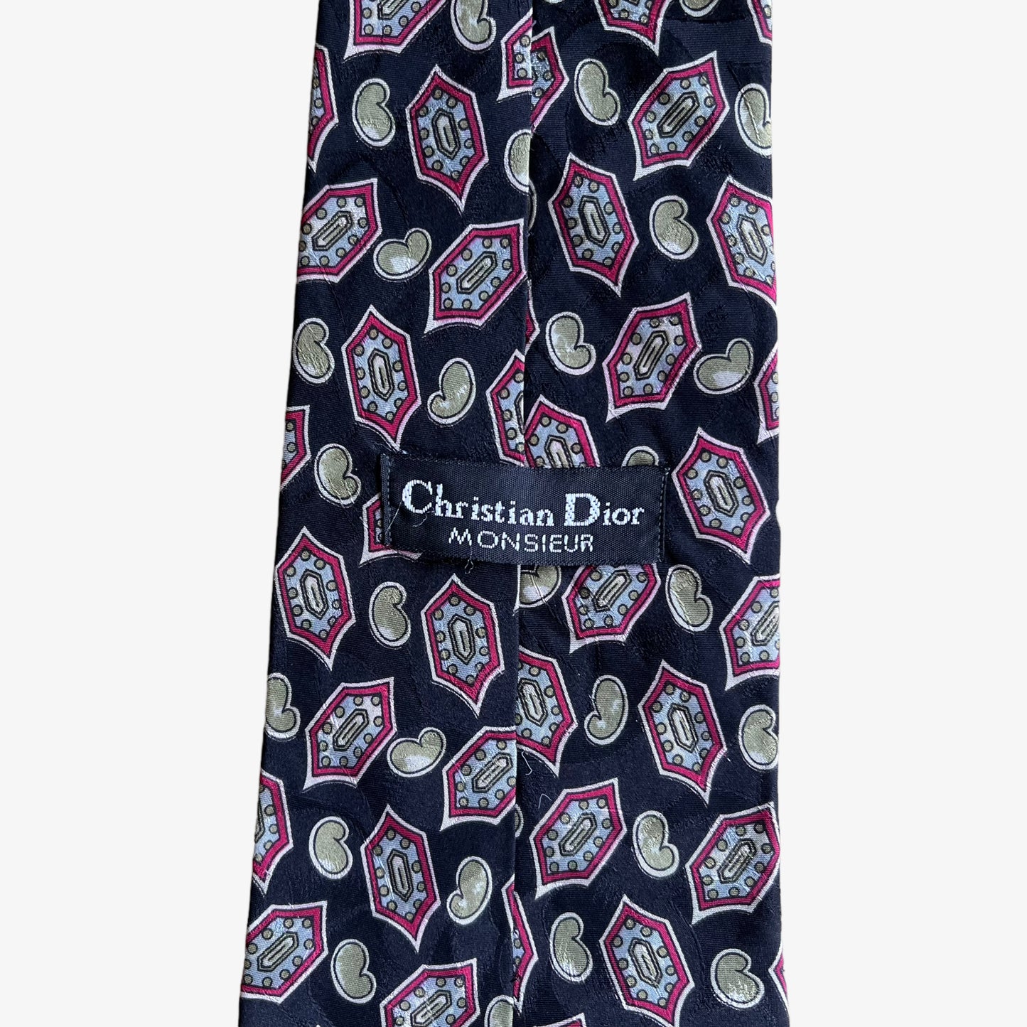 Label of vintage 80s Christian Dior monsieur paisley print silk tie.