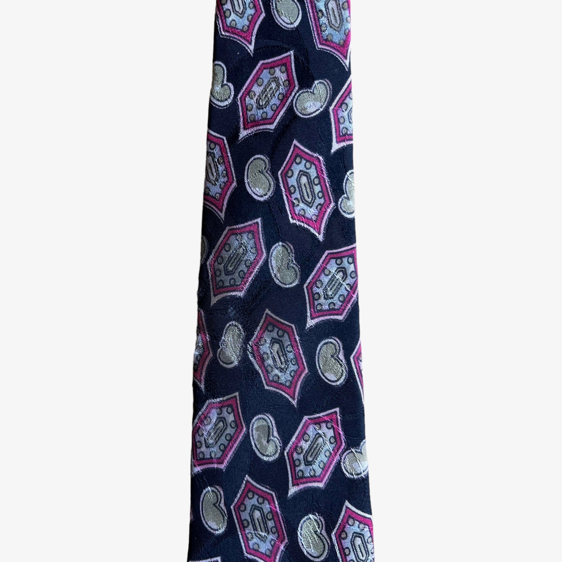 Close up of wear on vintage 80s Christian Dior monsieur paisley print silk tie.