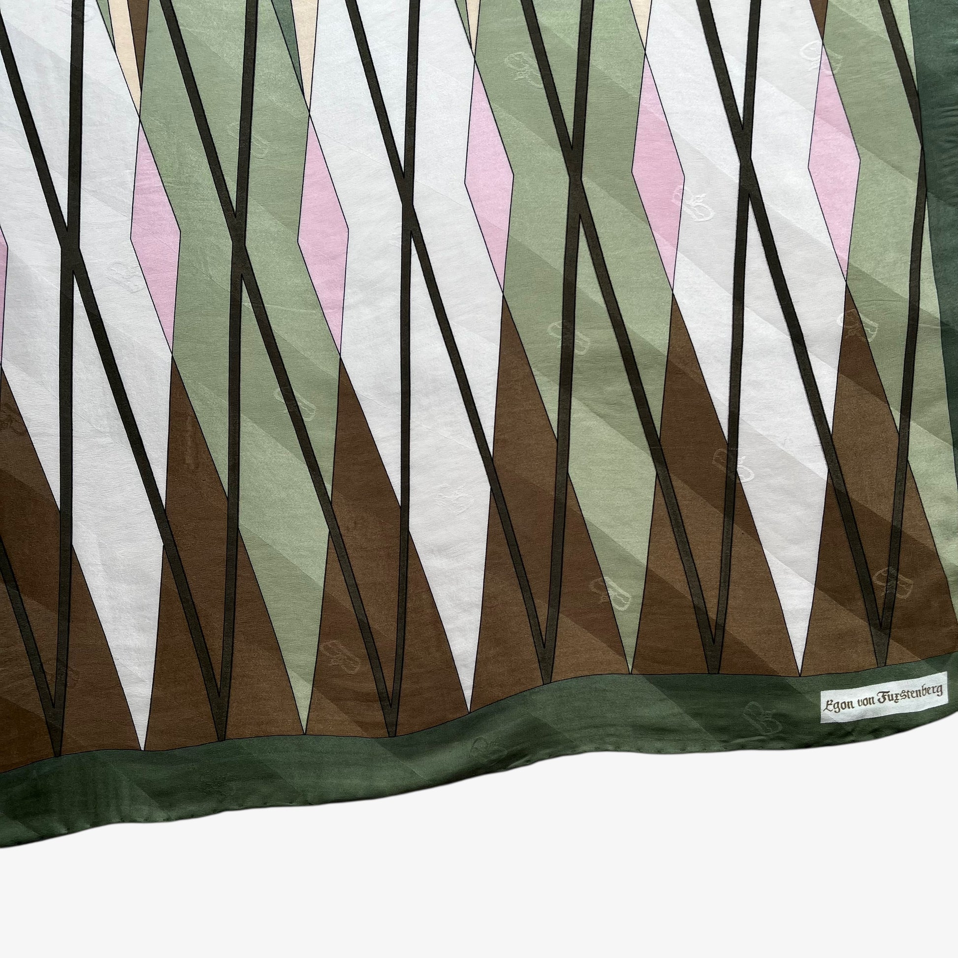 Close up of geometric abstract brown and pink tartan print of women's vintage 80s Egon Von Furstenberg green silk scarf.