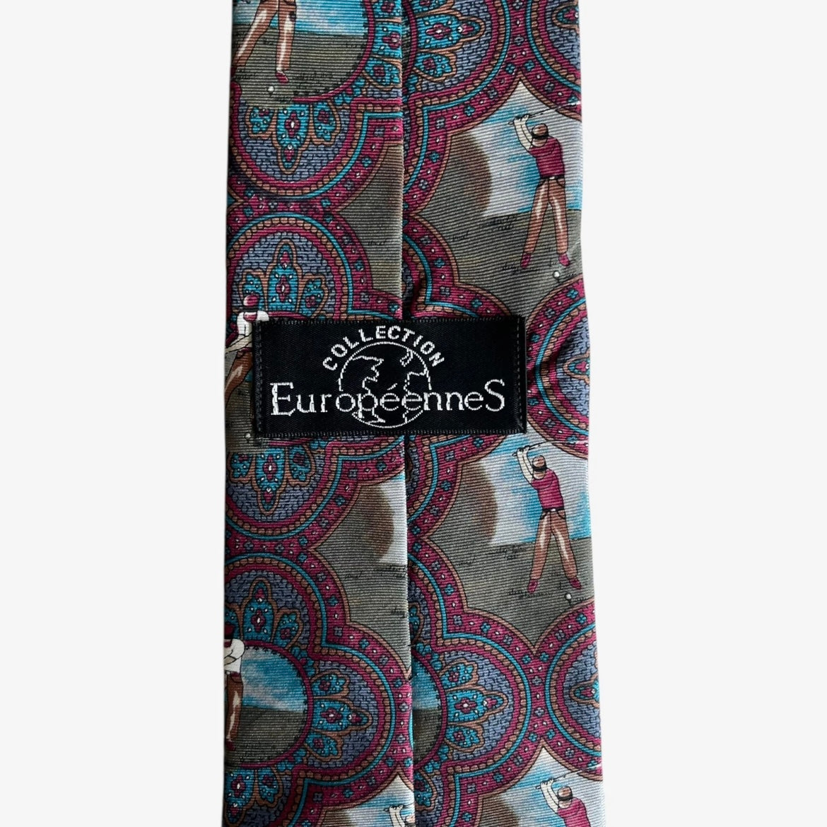 Label of vintage 80s Europeennes purple silk tie with geometric paisley and golf print design.