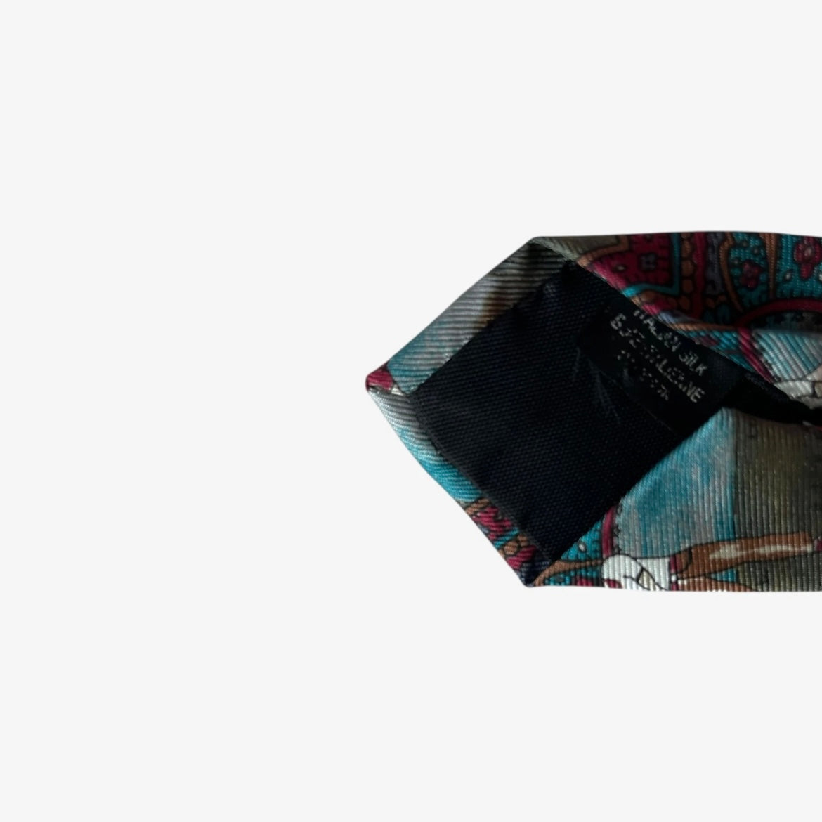 Material label of vintage 80s Europeennes purple silk tie with geometric paisley and golf print design.