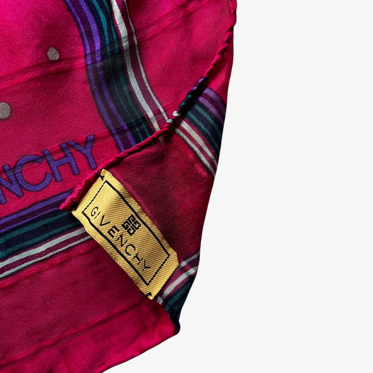 Givenchy label of women's vintage 80s pink silk scarf with a colourful polka dot pattern.