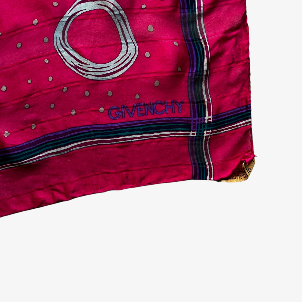 Givenchy spell out logo on women's vintage 80s pink silk scarf with a colourful polka dot pattern.