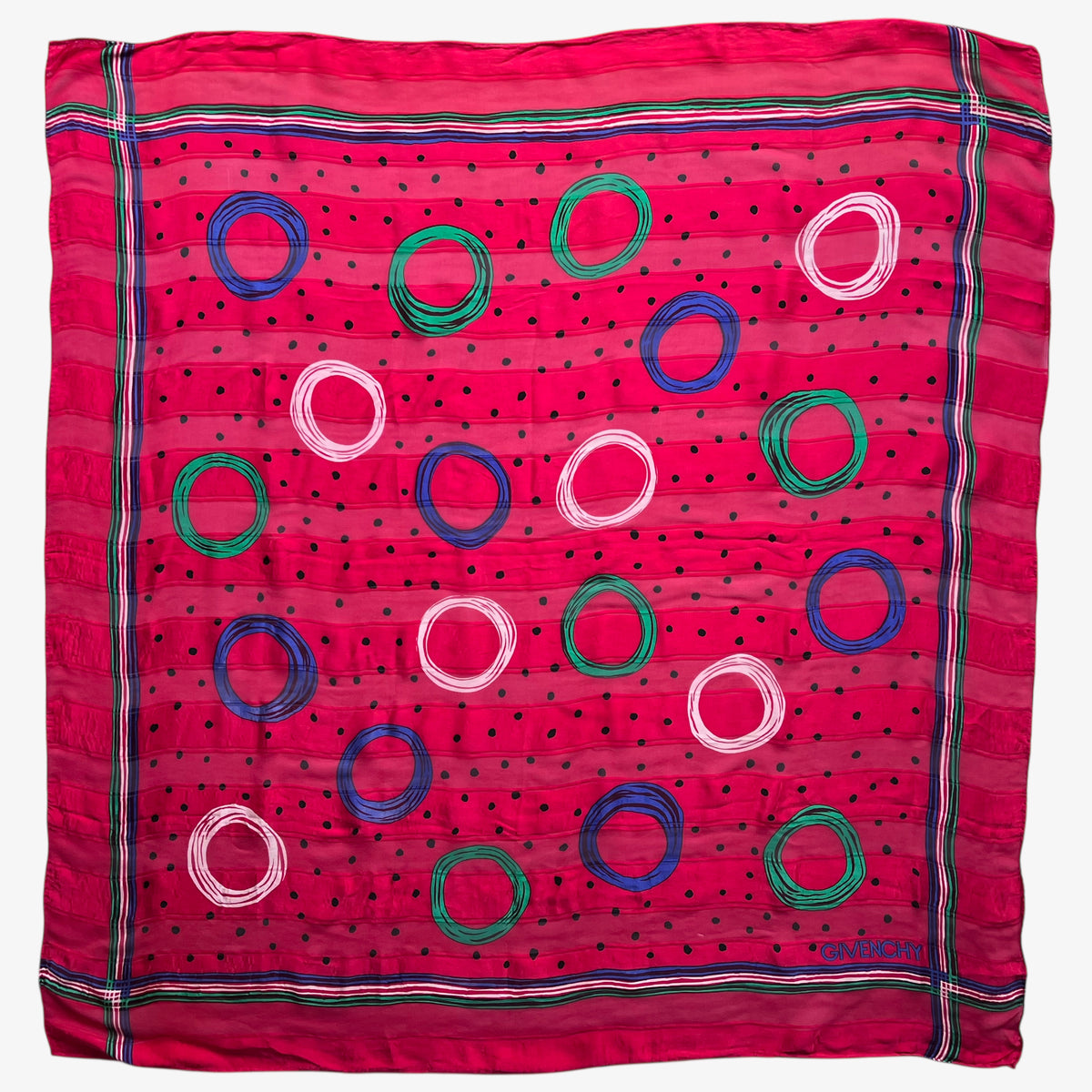 Vintage 80s Givenchy red silk scarf with a colourful polka dot pattern.