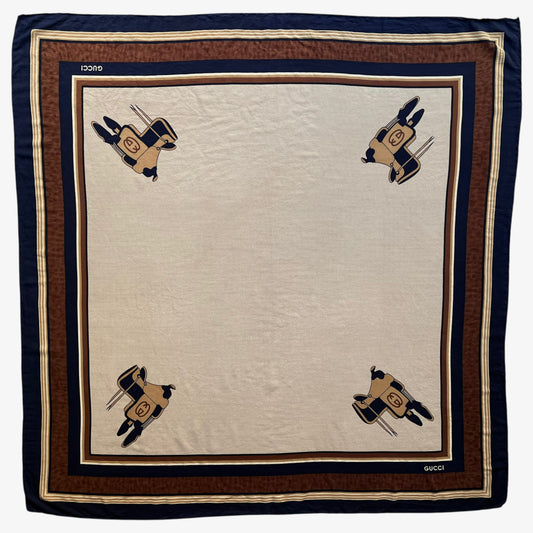 Women's vintage 80s Gucci equestrian saddle print brown silk scarf features a GG interlocking pattern.