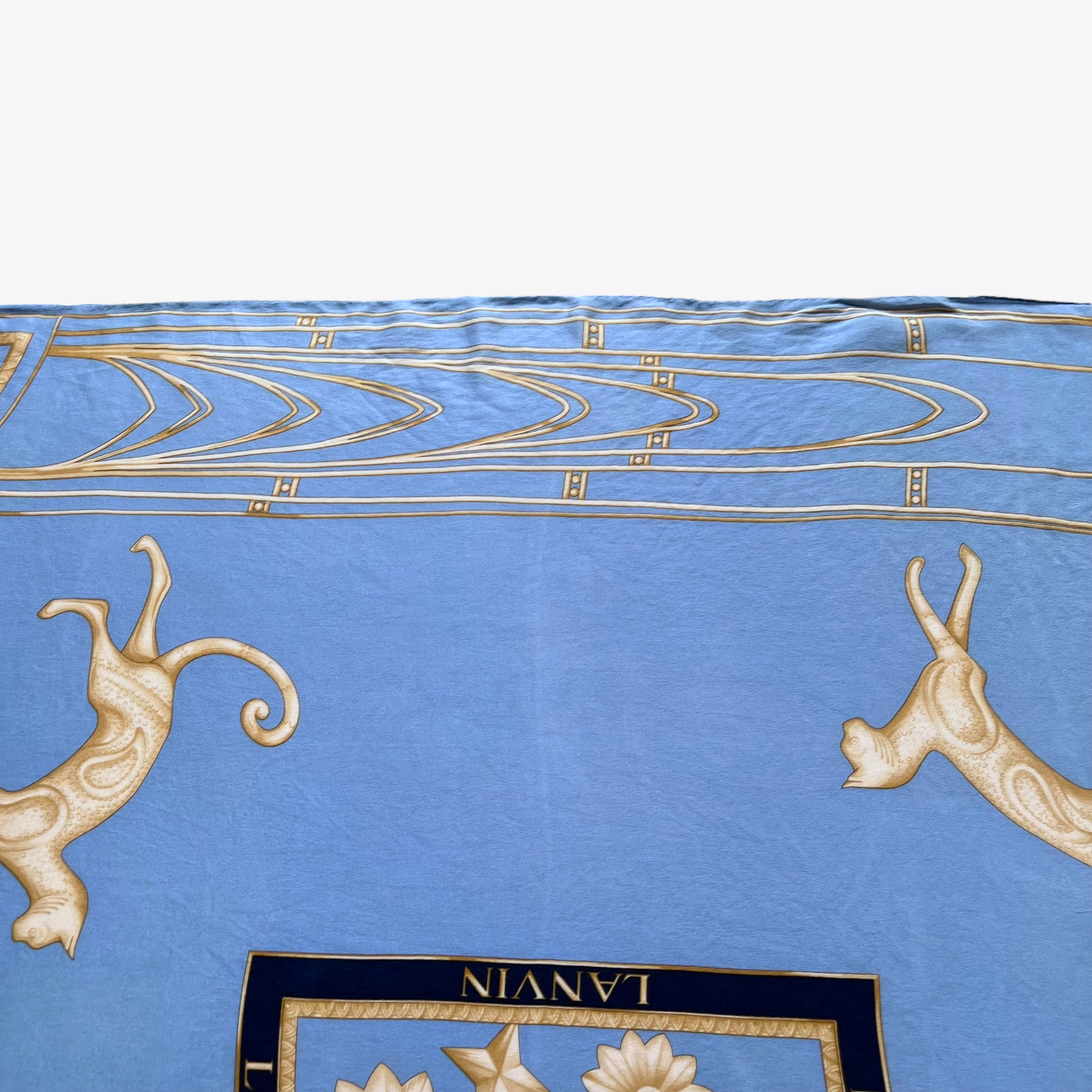 Faded colour on women's vintage 80s Lanvin Paris gold art deco cat print blue silk scarf.
