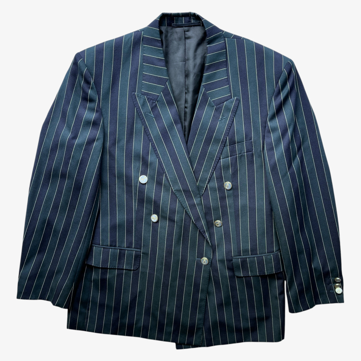 A vintage Beatties double-breasted navy and green pinstripe boating blazer with thin white vertical stripes, shown against a plain white background.