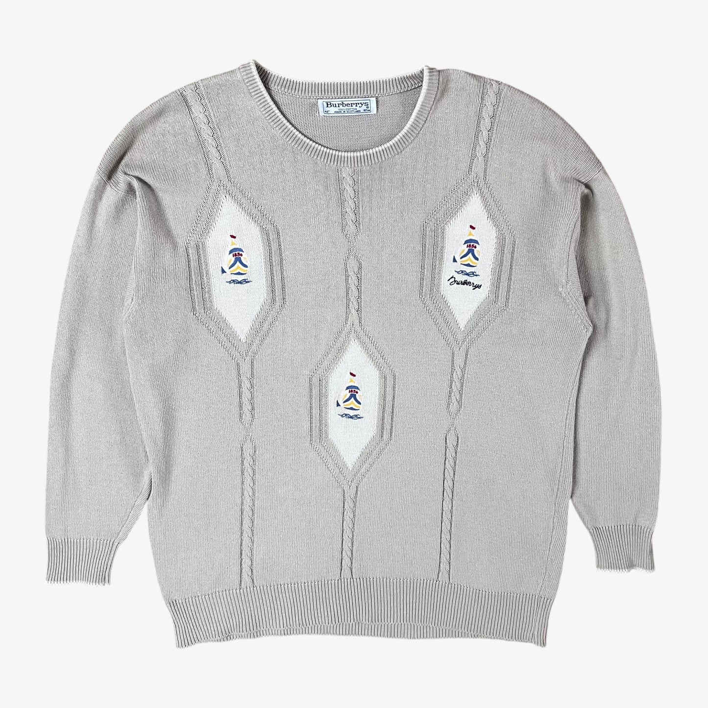 Vintage 80s Burberry men’s beige cable knit jumper with embroidered sailing motif.