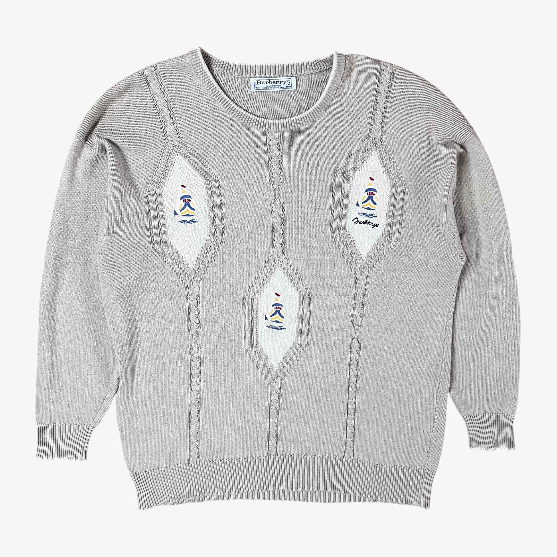 Vintage 80s Burberry men’s beige cable knit jumper with embroidered sailing motif.