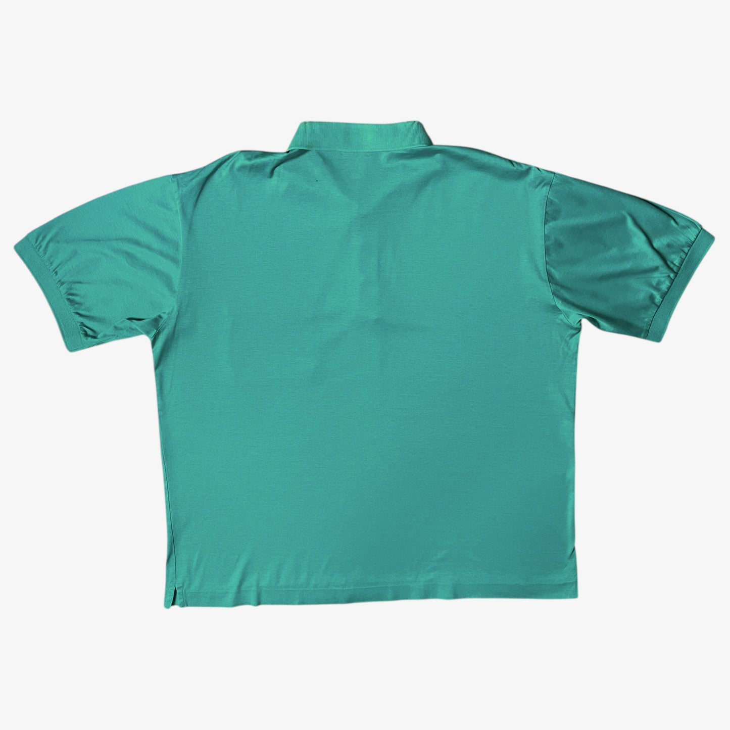 Back of vintage 80s men's Fila green polo shirt.