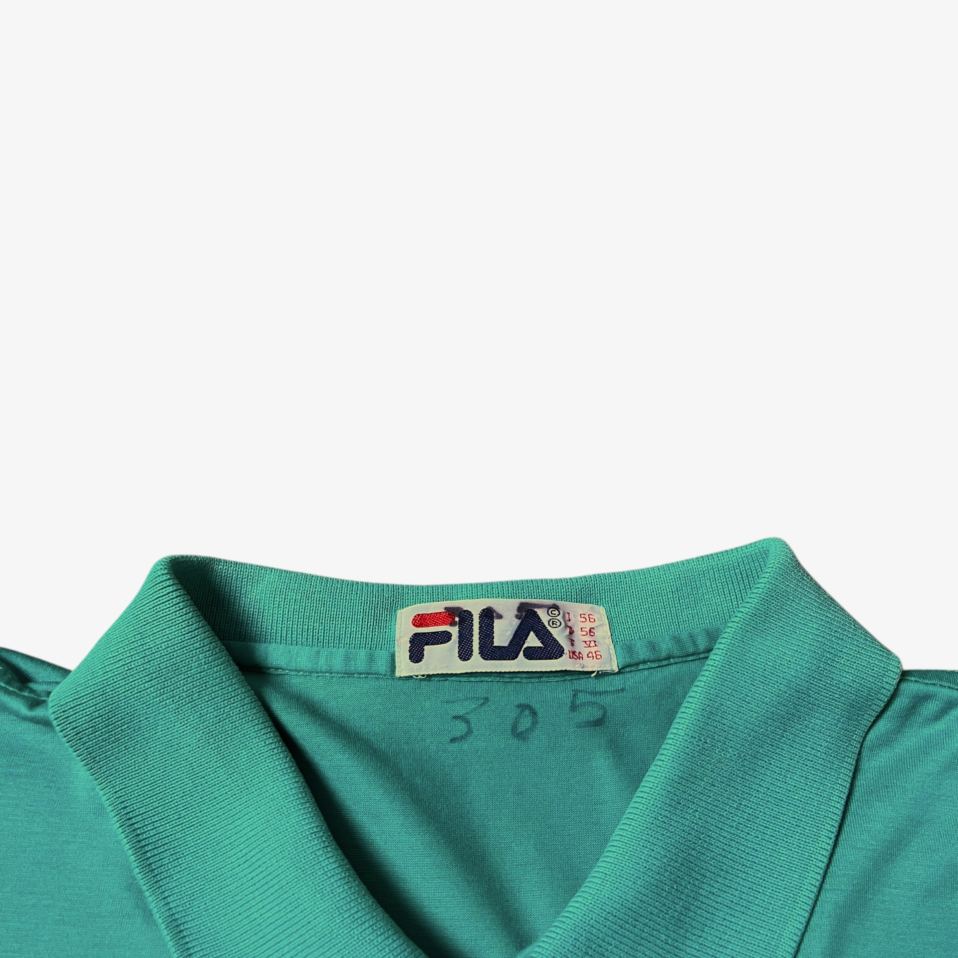 Vintage 80s Fila label stitched inside of a green polo shirt.