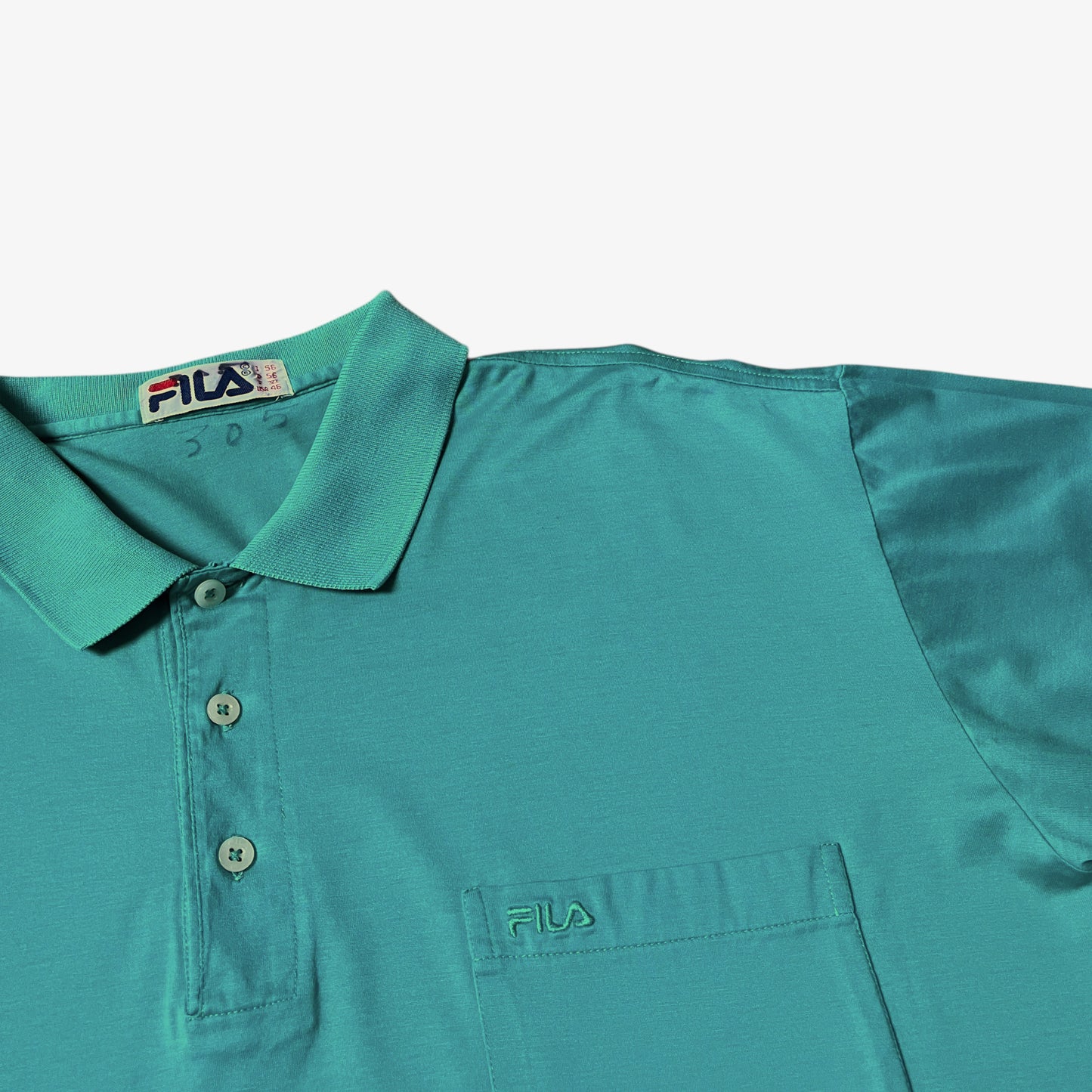 Fila embroidered spell out on a vintage 80s men's green polo shirt.