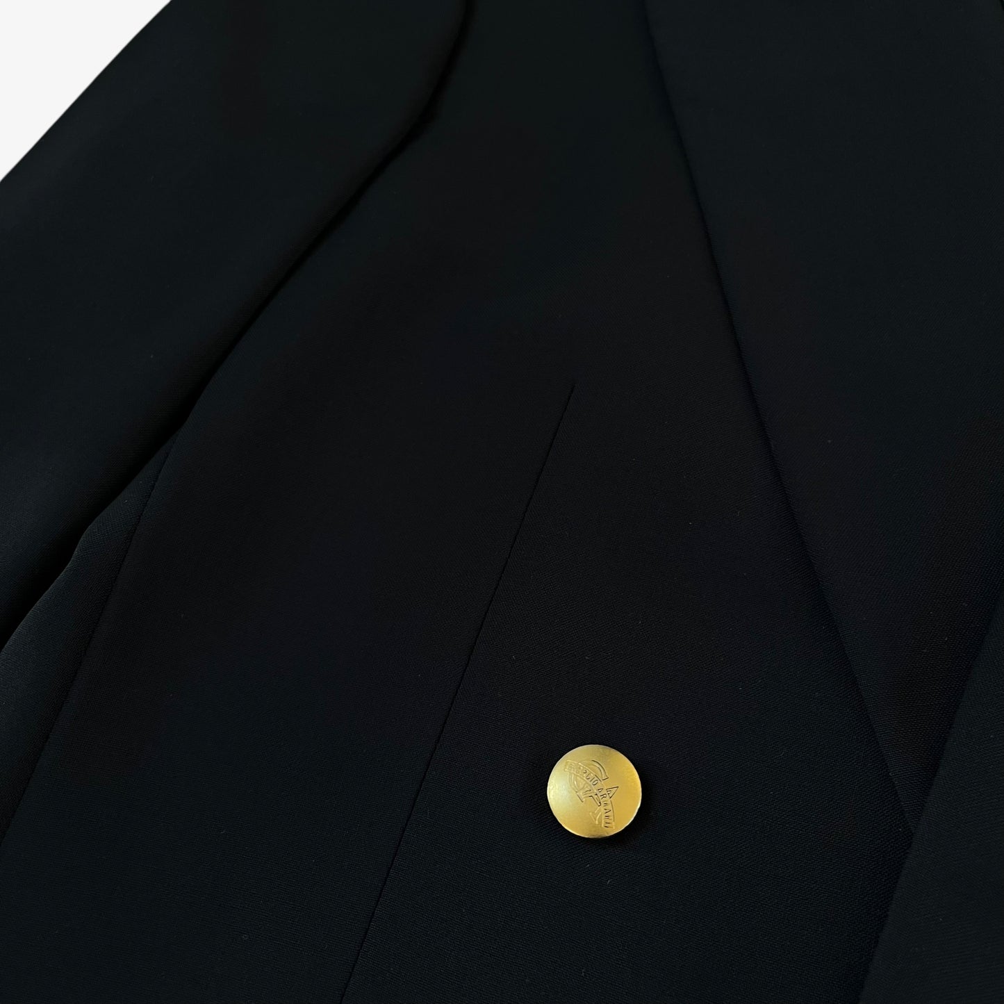 Giorgio Armani engraved button on men's Le Collezioni navy double breasted wool blazer.