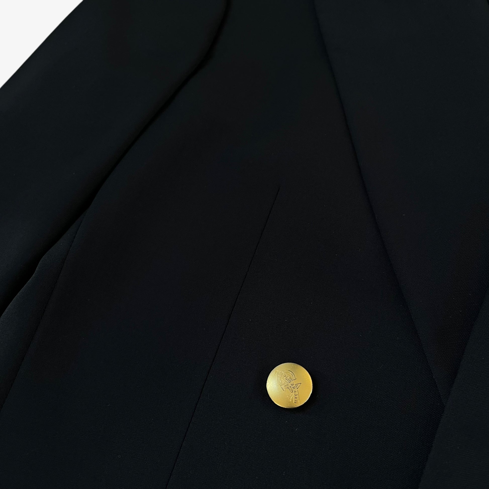 Giorgio Armani engraved button on men's Le Collezioni navy double breasted wool blazer.