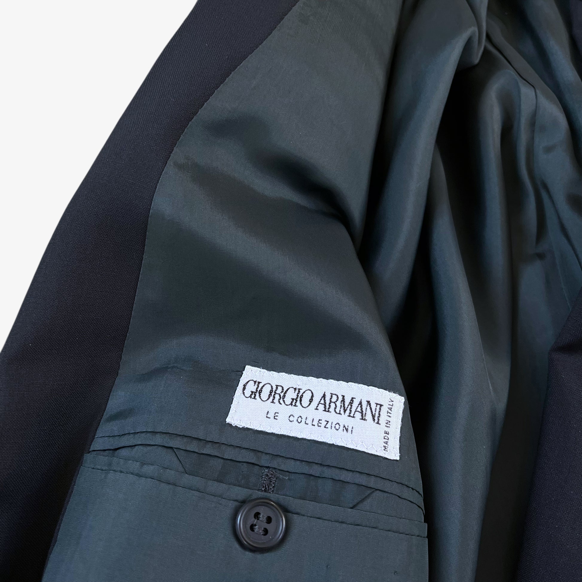 Giorgio Armani Le Collezioni label stitched inside of vintage 80s men's navy double breasted wool blazer.