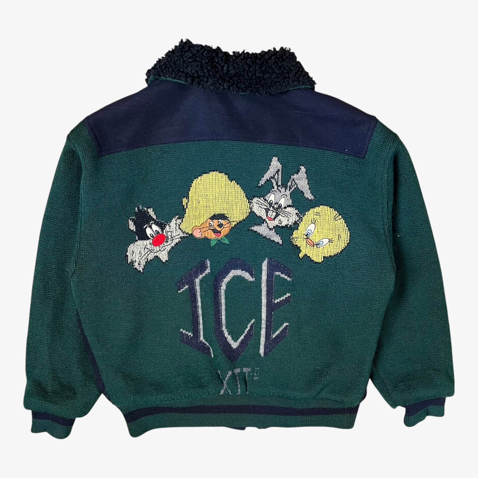 Back of vintage 80s Looney Tunes ICEBERG men’s green and navy wool varsity jacket from 1987 with embroidered cartoon details and letterman style.