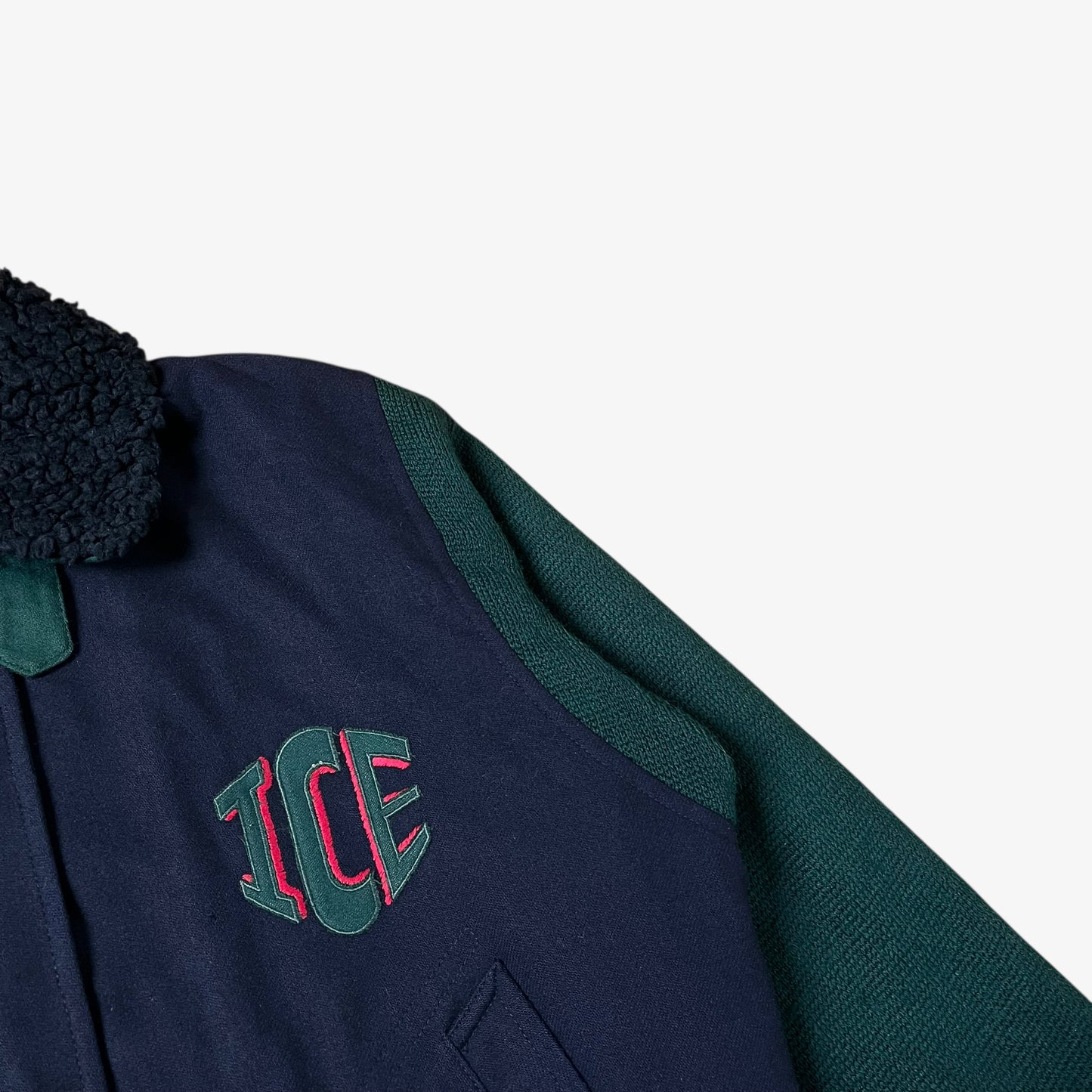 ICE badge of vintage 80s Looney Tunes ICEBERG men’s green and navy wool varsity jacket.