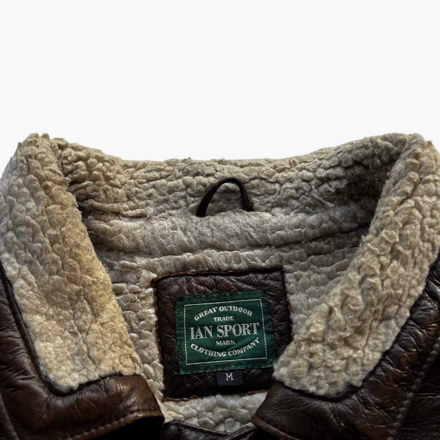 Ian Sport label stitched inside of vintage 80s men's leather and wool blend tartan print jacket.