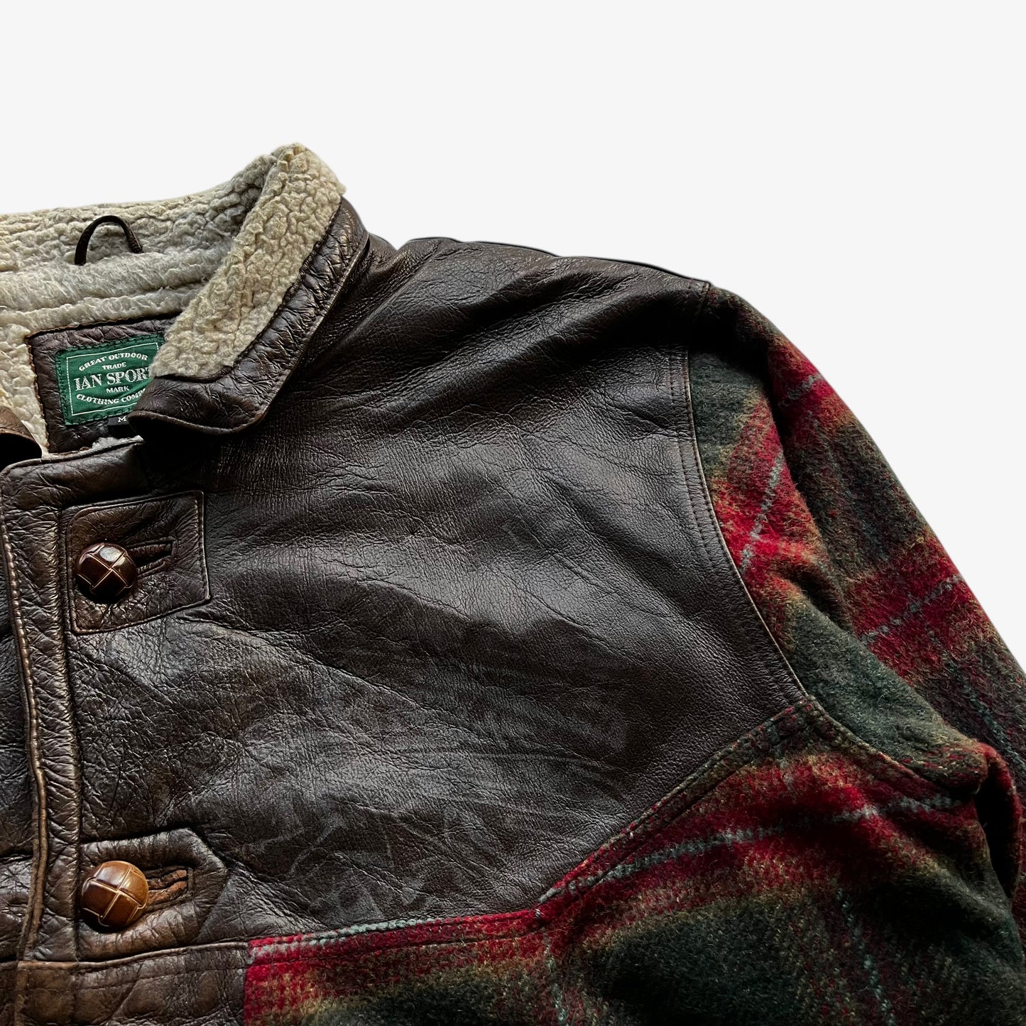 Patina on vintage 80s men's Ian Sport leather and wool blend tartan print jacket.