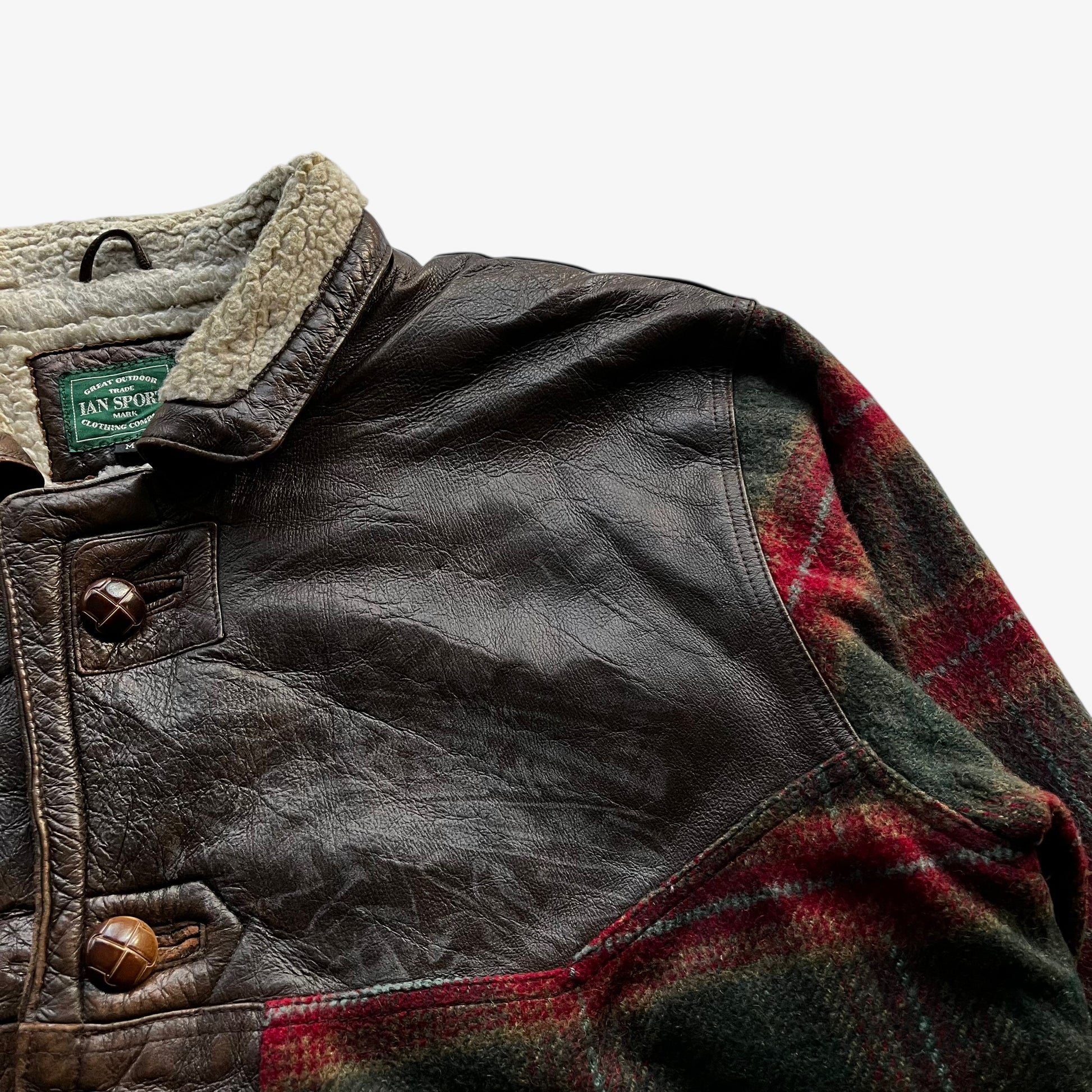 Patina on vintage 80s men's Ian Sport leather and wool blend tartan print jacket.
