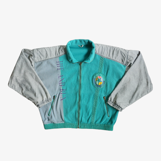 Vintage 80s men's Luhta world series mountain explorers blue and grey fleece jacket with a full zip closure and text on the chest.
