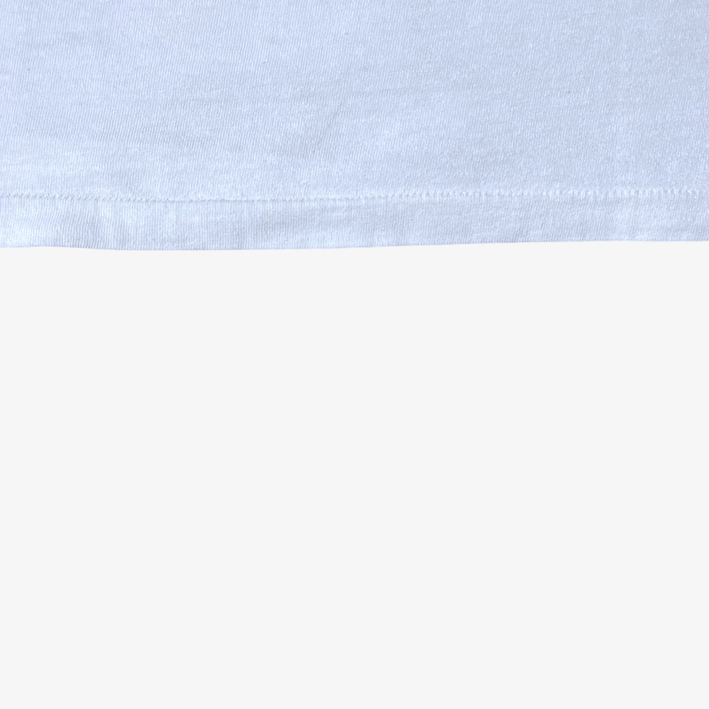 Single stitch hem of vintage 80s men's The Shining here's Johnny Jack Nicholson print single stitch white t-shirt.