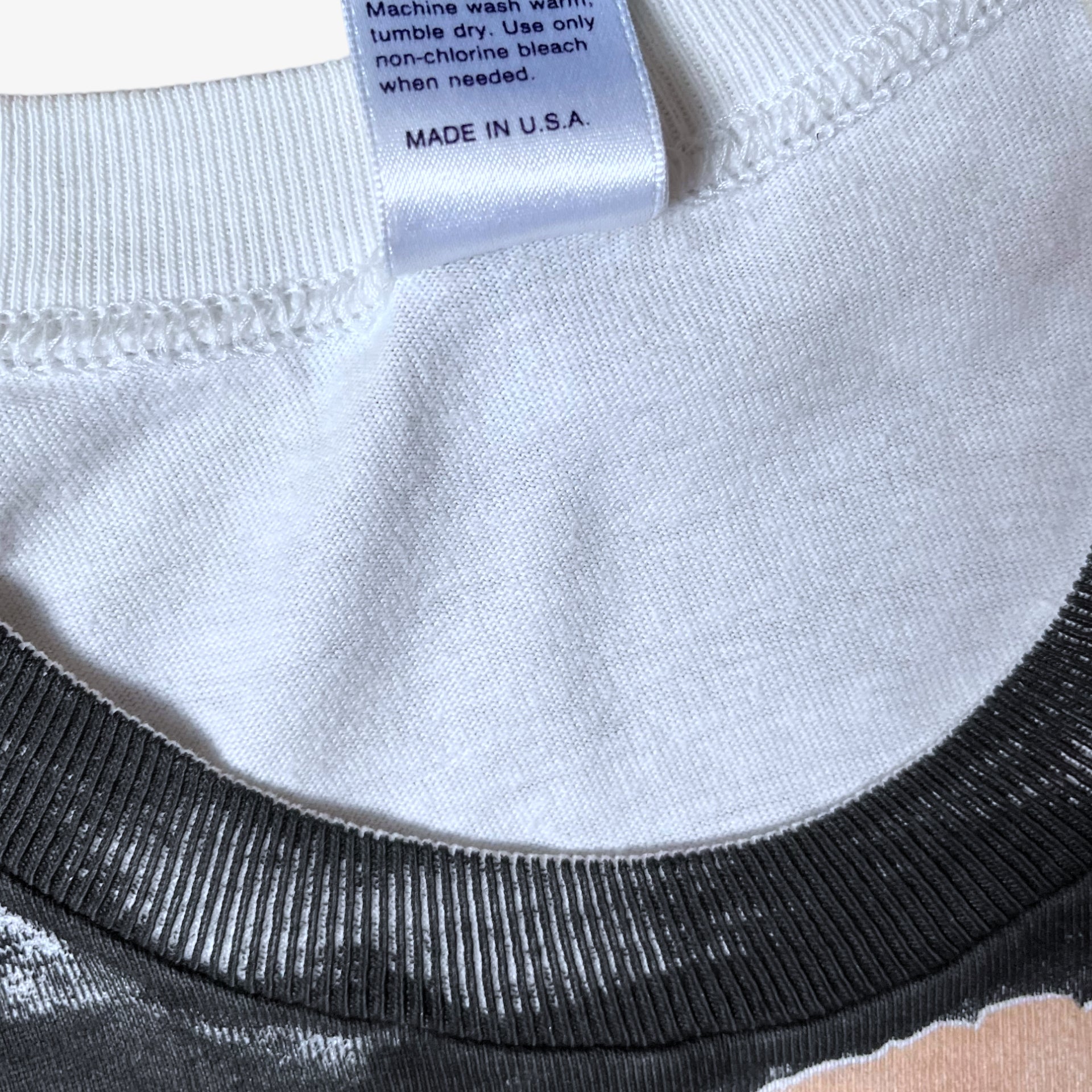 Made in USA label stitched inside of vintage 80s men's The Shining here's Johnny Jack Nicholson print single stitch white t-shirt.