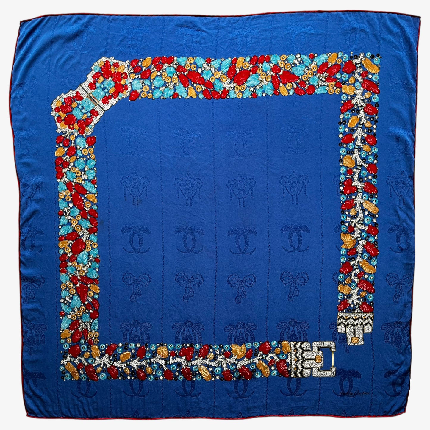 Women's vintage 80s Must de Cartier interlocking cc print blue silk scarf with a red jewelled belt trim.