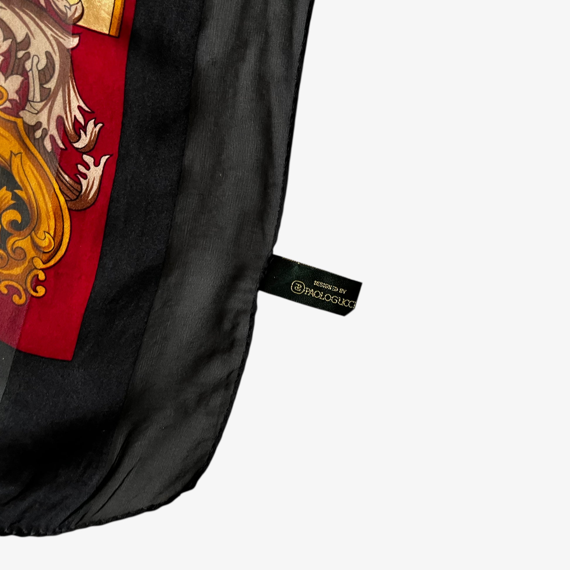 Paolo Gucci label on a vintage 80s women's black and yellow striped silk scarf features a golden baroque print.