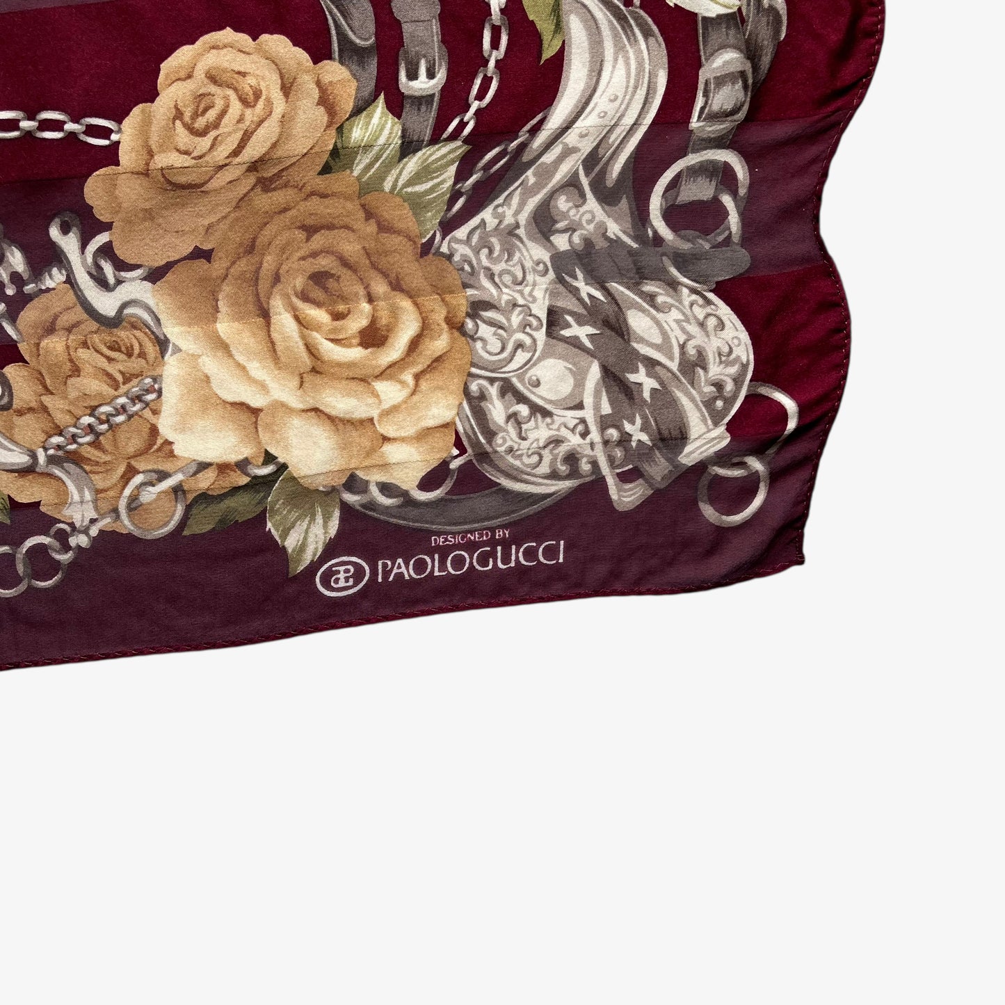Paolo Gucci spell out logo on women's vintage 90s equestrian buckle and floral checkered print red silk scarf.