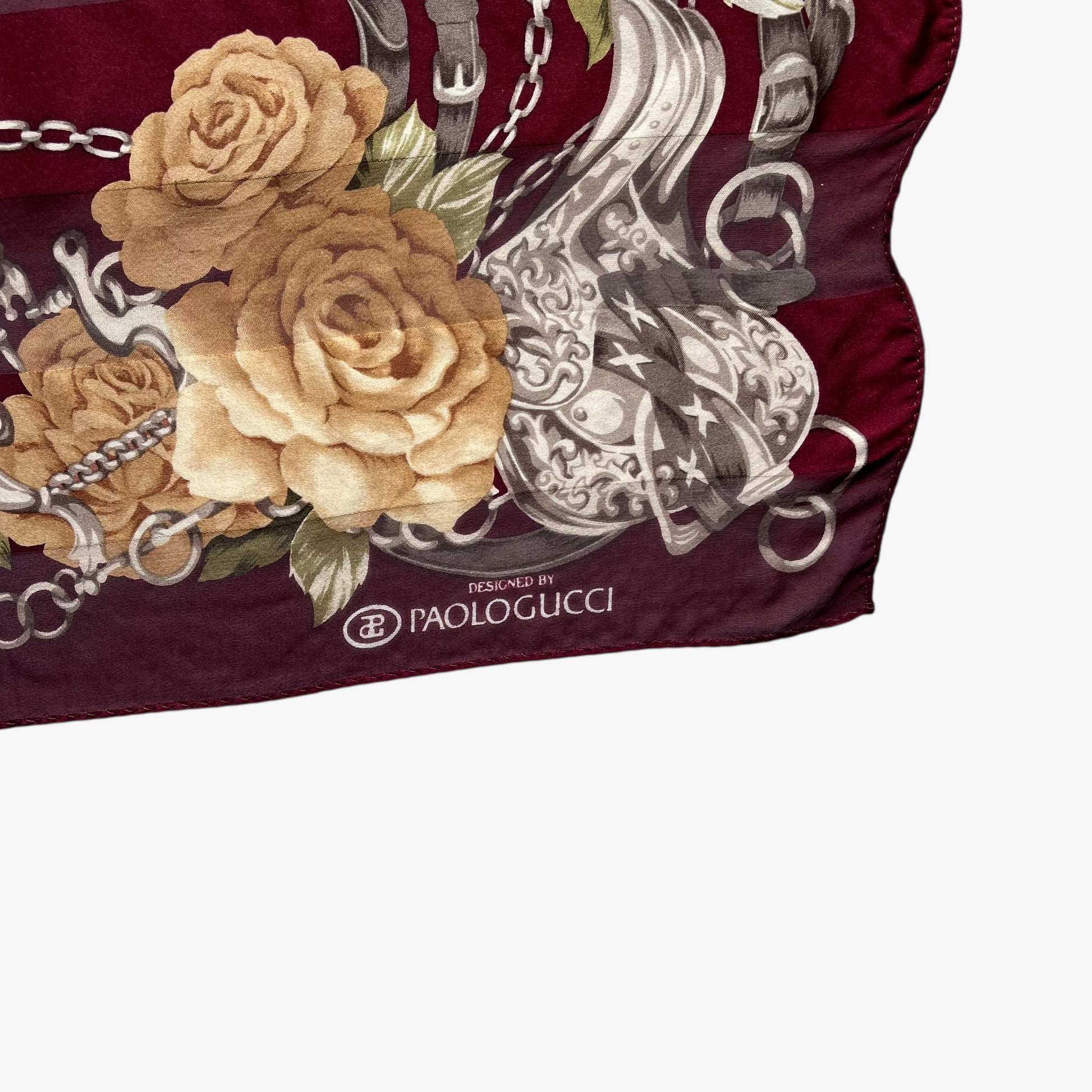 Paolo Gucci spell out logo on women's vintage 90s equestrian buckle and floral checkered print red silk scarf.