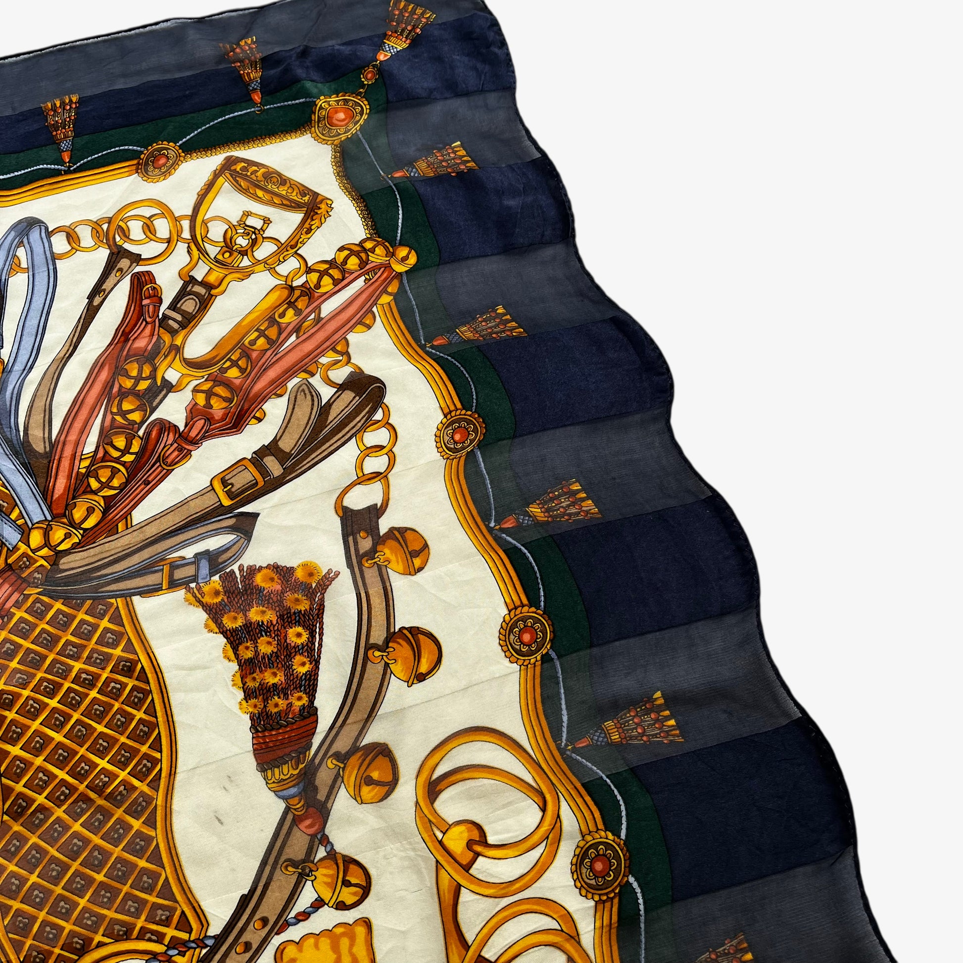 Patina on women's vintage 90s Paolo Gucci equestrian saddle and horsebit print silk scarf.
