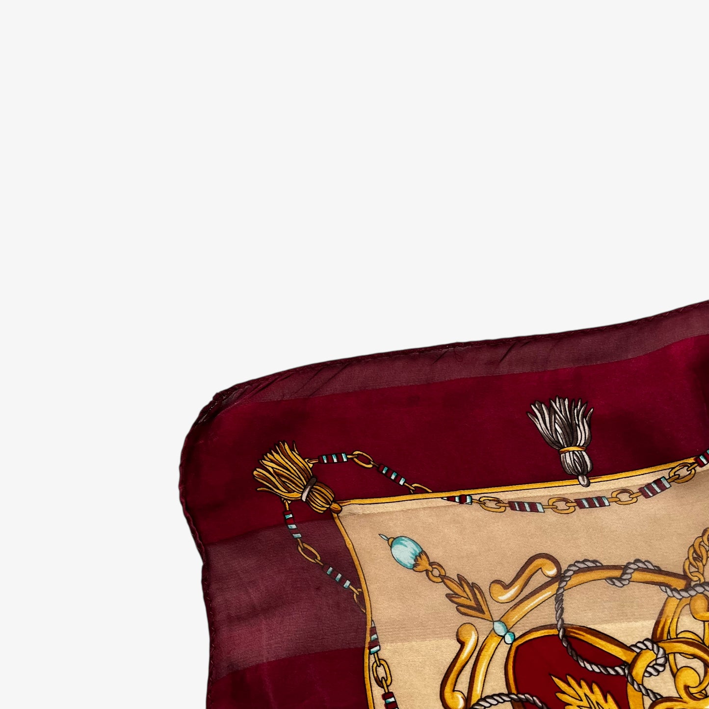 Patina on women's vintage 80s Paolo Gucci red silk scarf features a gold medallion chain and purple tartan print.