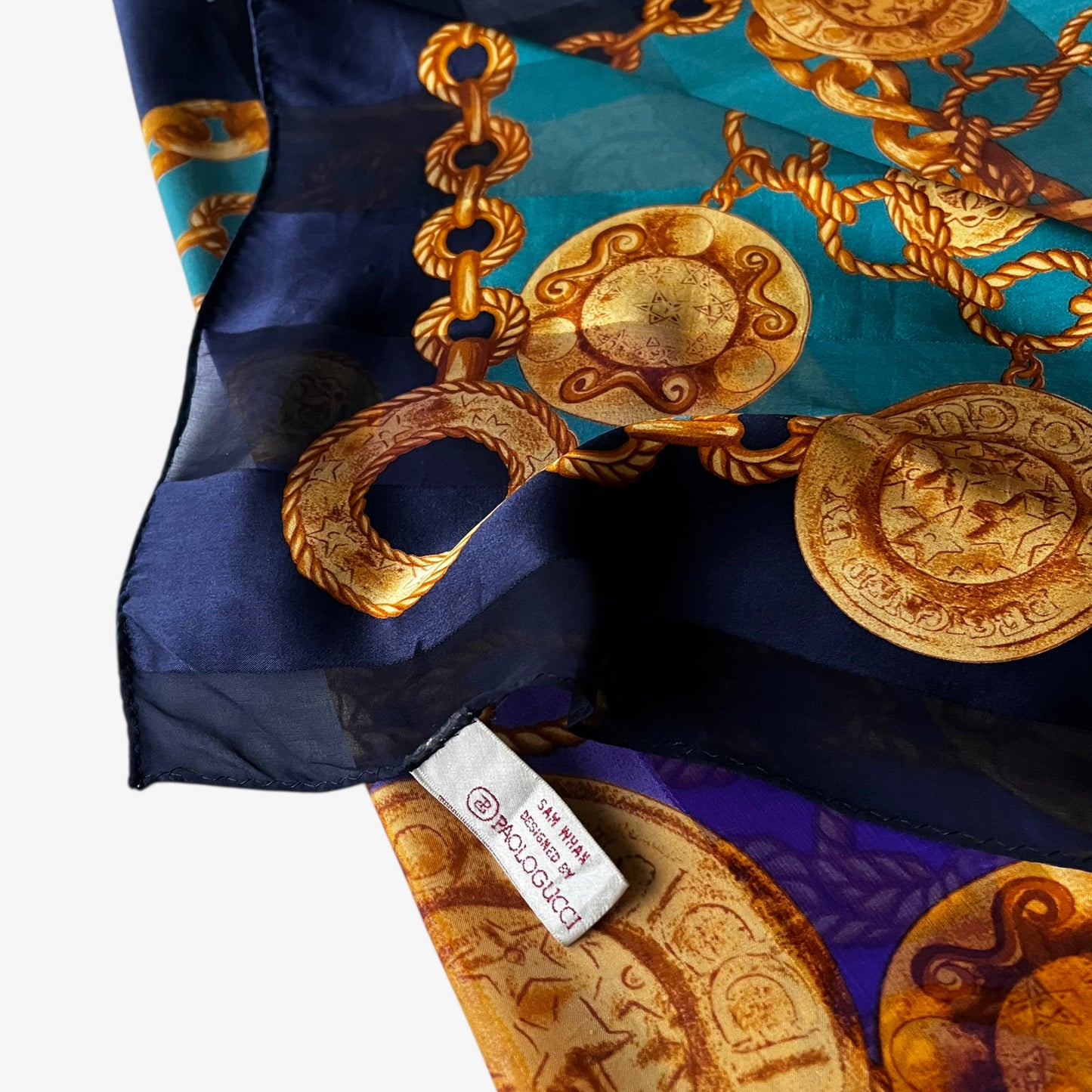 Paolo Gucci Sam Whan label on women's vintage 90s gold medallion chain print green and purple silk scarf.